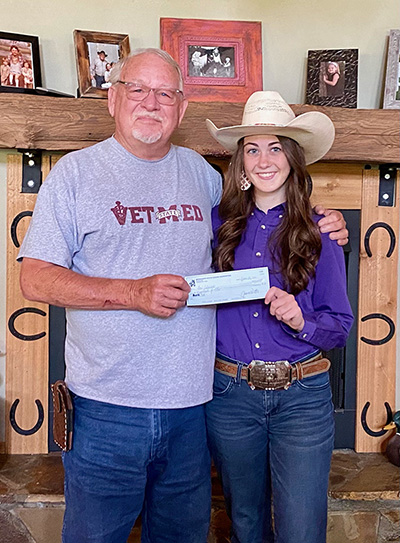 National Little Britches Rodeo Finals - Josi Johnson receiving a Sponsorship Check from James Rasberry